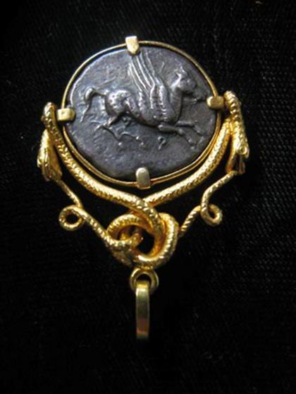 Appraisal: Coin pendant karat yellow gold pendant of Grecian serpent form