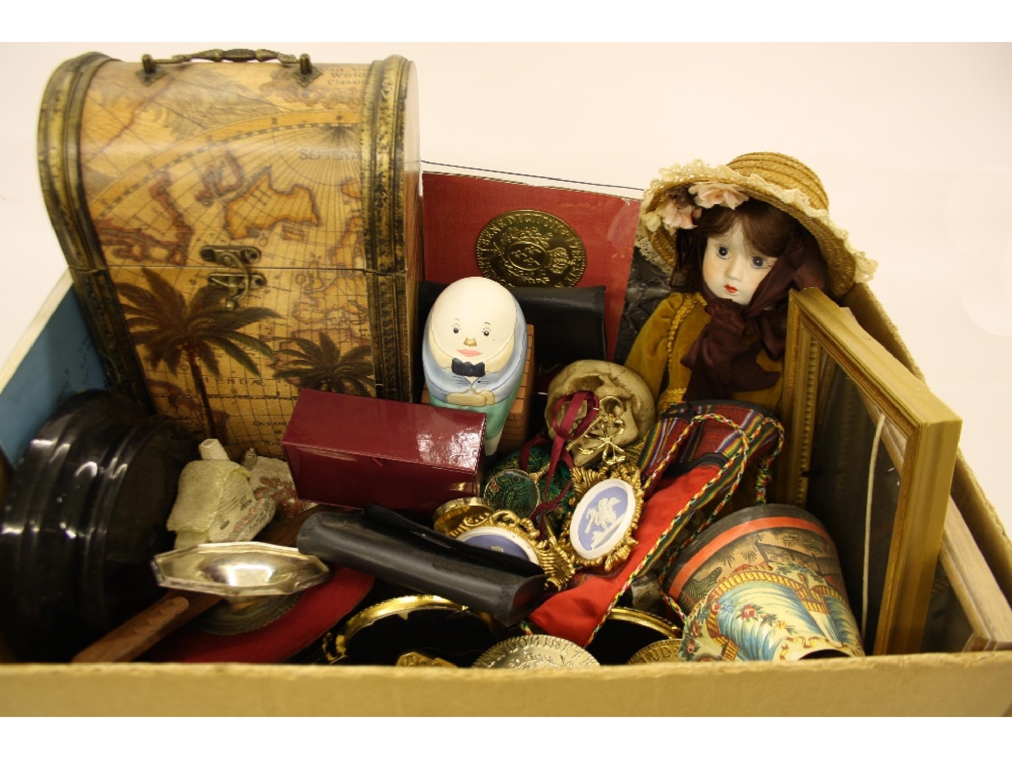 Appraisal: Box of interesting items to include porcelain doll Eastern items