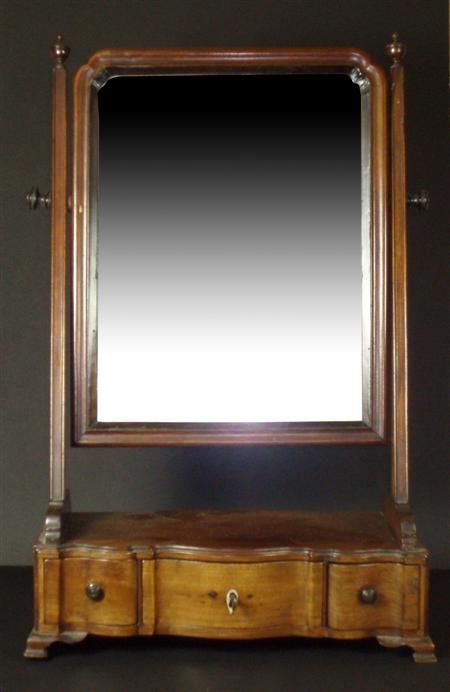 Appraisal: A Georgian mahogany dressing mirror the plain mirror with moulded