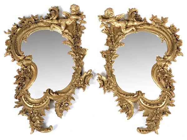 Appraisal: A pair of Italian Rococo style gilt decorated mirrors with