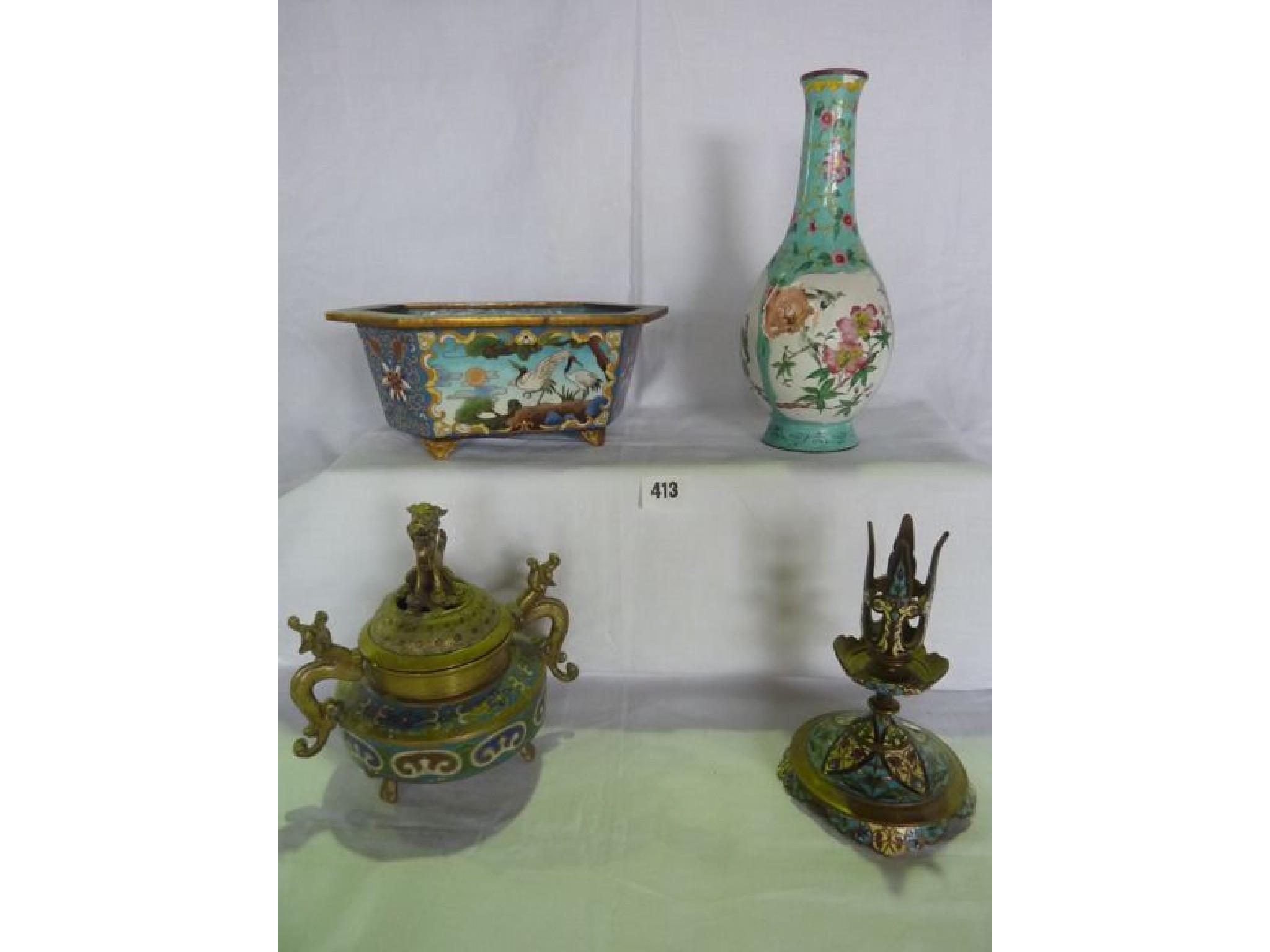 Appraisal: A cloisonn enamelled jardini re of elongated hexagonal form and