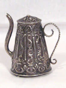 Appraisal: An antique silver miniature coffee pot with Dutch hallmarks to