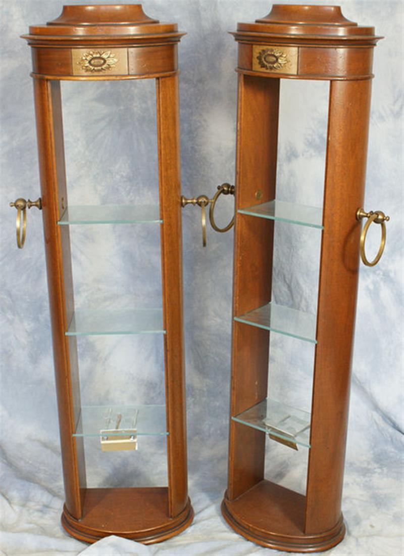 Appraisal: Pair of Regency style mahogany curio shelves with brass mounts