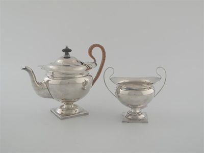 Appraisal: An Edwardian bachelors teapot and sugar bowl on square pedestal