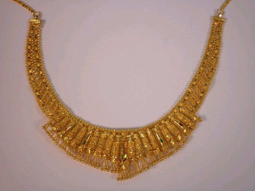 Appraisal: An Asian gold wedding necklace an ornate collar design stamped