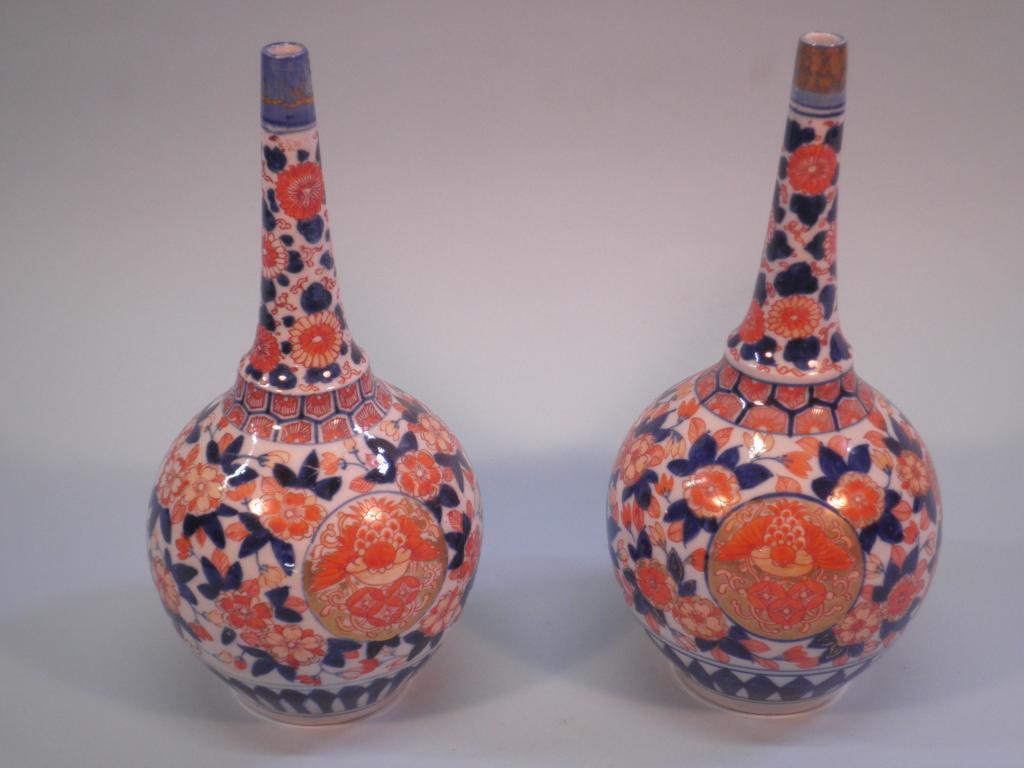 Appraisal: A pair of thC Japanese Imari bottle shaped vases cm