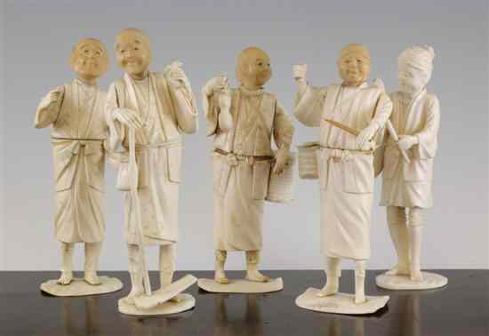 Appraisal: A Japanese sectional ivory figure of a woodsman two character