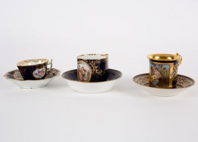 Appraisal: Three late th Century Continental porcelain blue ground cabinet cups