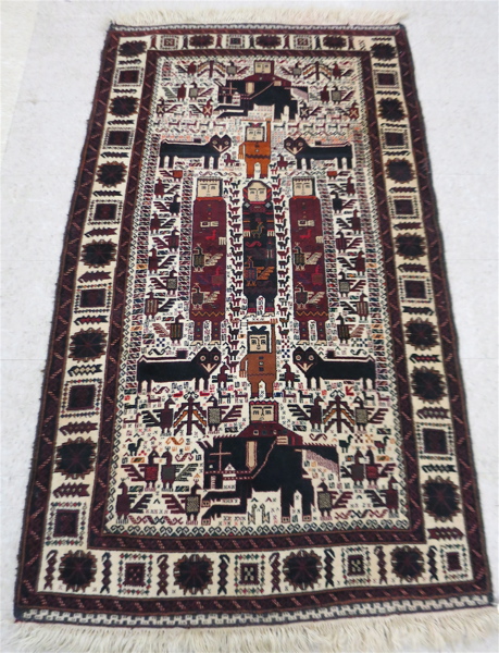 Appraisal: PICTORIAL AFGHAN BELOUCHI TRIBAL RUG the rectangular ivory field decorated