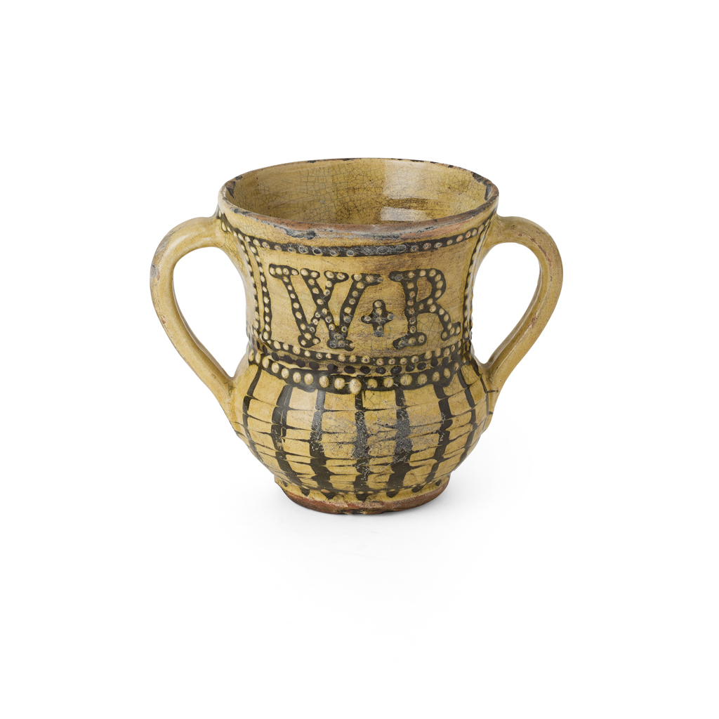 Appraisal: ENGLISH SLIPWARE LOVING CUP TH CENTURY with a flared rim