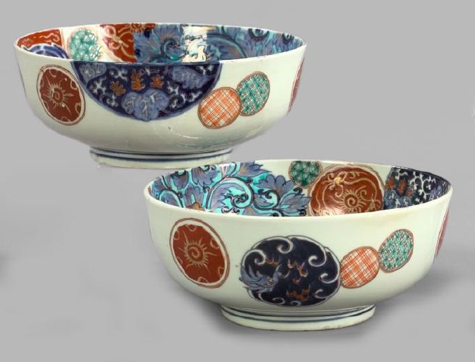 Appraisal: Attractive Pair of Japanese Meiji Segmented Brocade Imari Porcelain Fruit