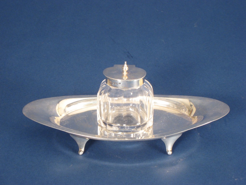 Appraisal: A Victorian oval Inkstand with faceted ink bottle Sheffield