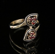 Appraisal: A Ladies' Ring Set With Garnets A ladies' ring in