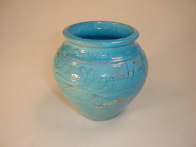 Appraisal: A turquoise stoneware bulbous vase with stylised hare decoration