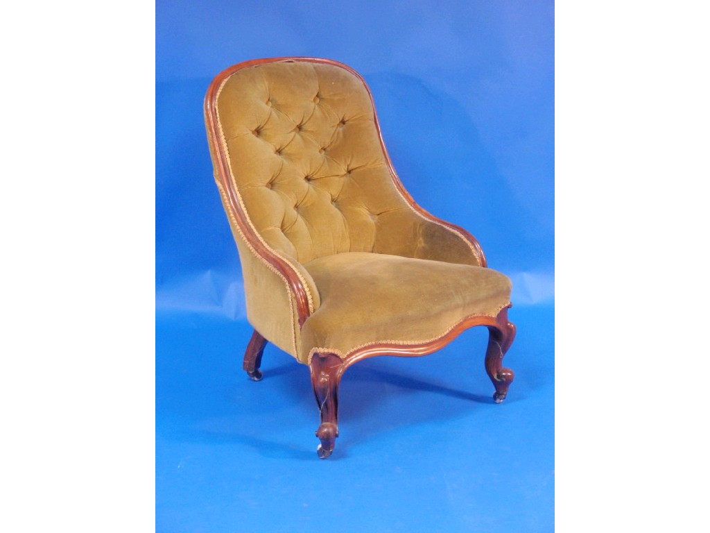 Appraisal: A Victorian walnut framed nursing chair with serpentine seats and