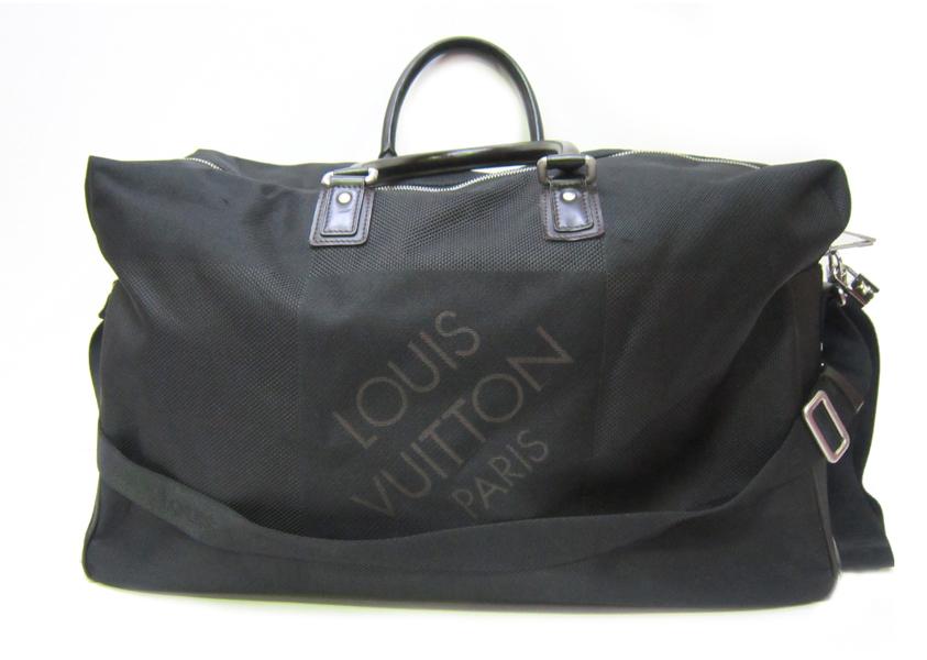 Appraisal: A LOUIS VUITTON OVERNIGHT BAG IN BLACK DAMIER GEANT CANVAS