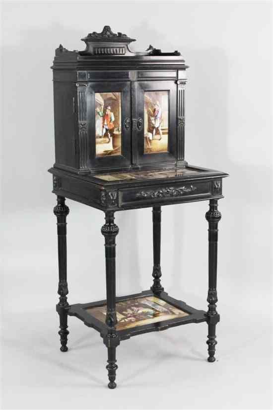 Appraisal: A th century German ebonised pipe cabinet with two panelled