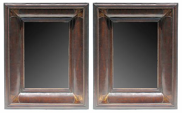 Appraisal: A pair of Portugese style leather framed mirrors height in