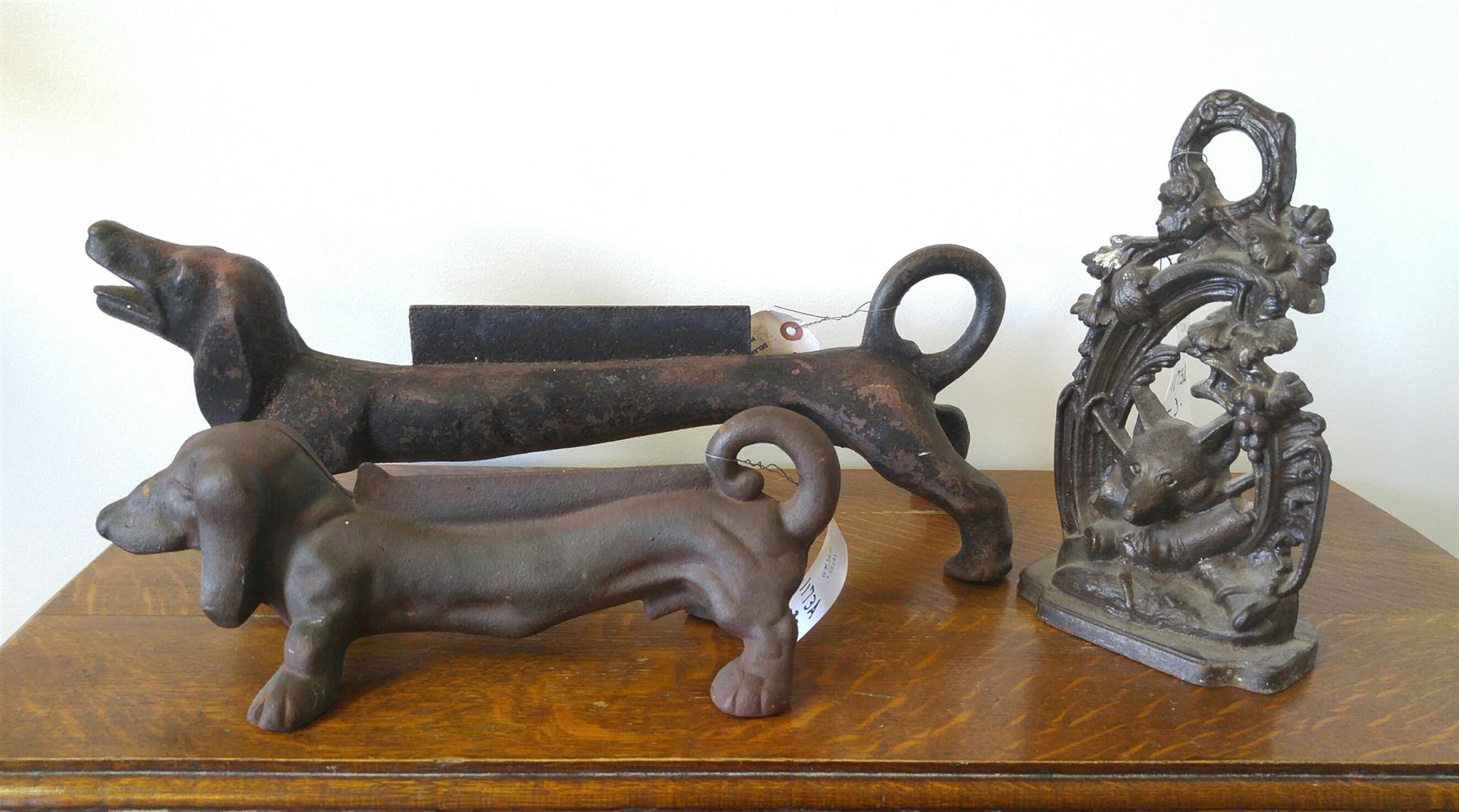 Appraisal: THREE CAST IRON PIECES American mid th century Two dachshund