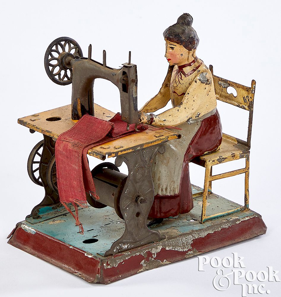 Appraisal: Gunthermann tin woman at sewing machine steam toy Gunthermann painted