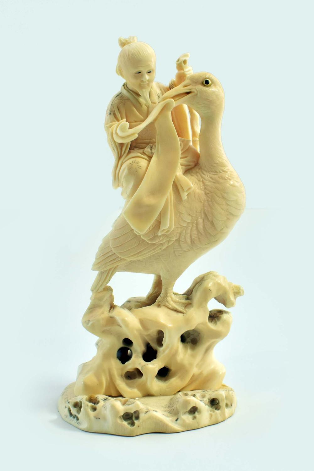 Appraisal: CHINESE CARVING OF A SCHOLAR RIDING A STORKThe elderly bearded