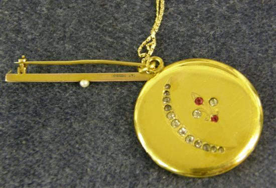 Appraisal: A DIAMOND AND RUBY SET CIRCULAR LOCKET on a gold