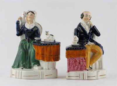 Appraisal: A pair of Staffordshire figures of a man and his