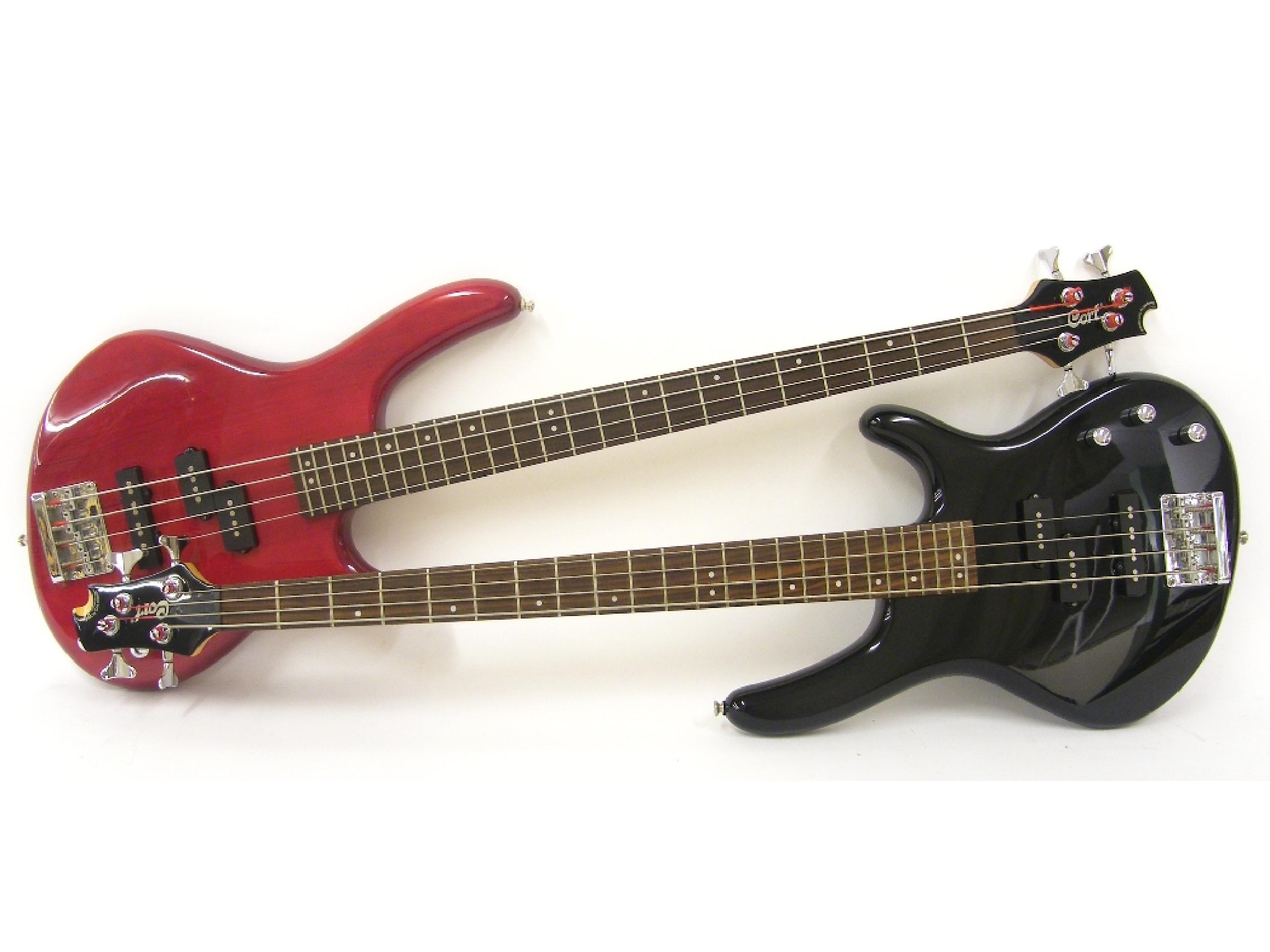 Appraisal: Two Cort Action bass guitars one in black the other