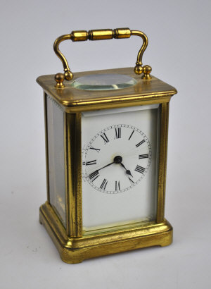 Appraisal: A th century lacquered brass carriage clock with white enamelled