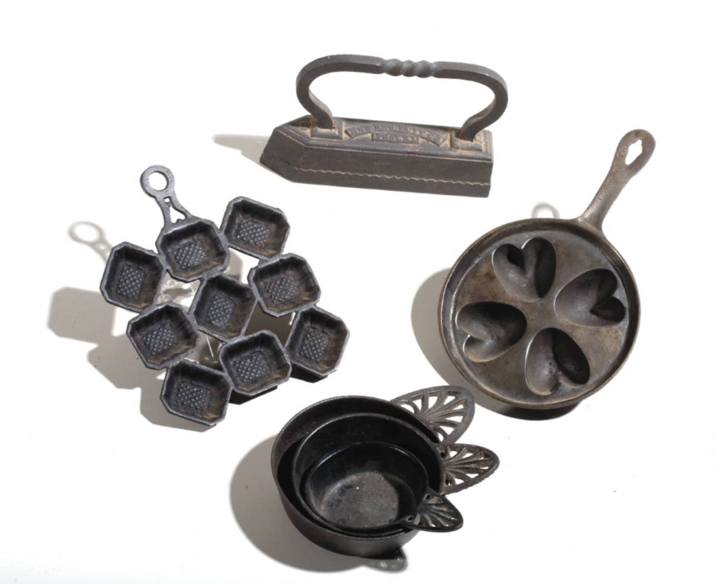 Appraisal: GROUP OF CAST-IRON HEARTH ACCESSORIES INCLUDING A HEART-FORM MOLD Together