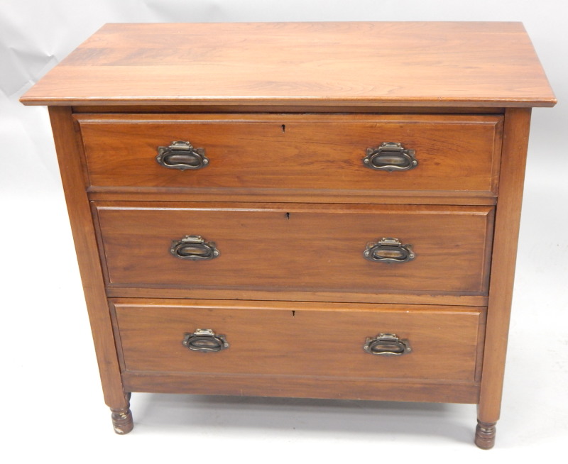 Appraisal: An Edwardian walnut chest of three long drawers with Art