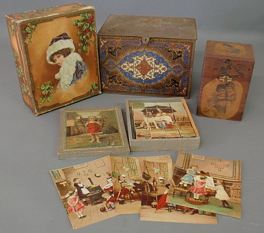 Appraisal: Boxed lithographed puzzle h decorated tin biscuit box h x