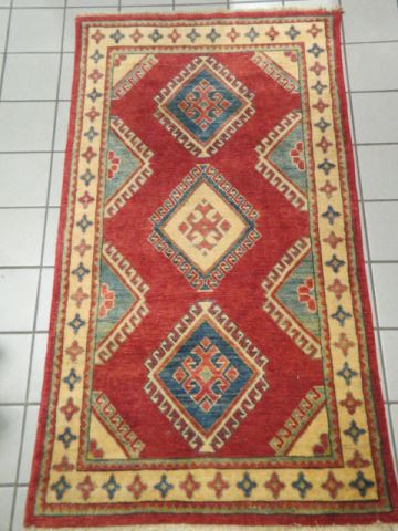 Appraisal: Kazak Persian Handmade Rug triple geometric designes on salmon field