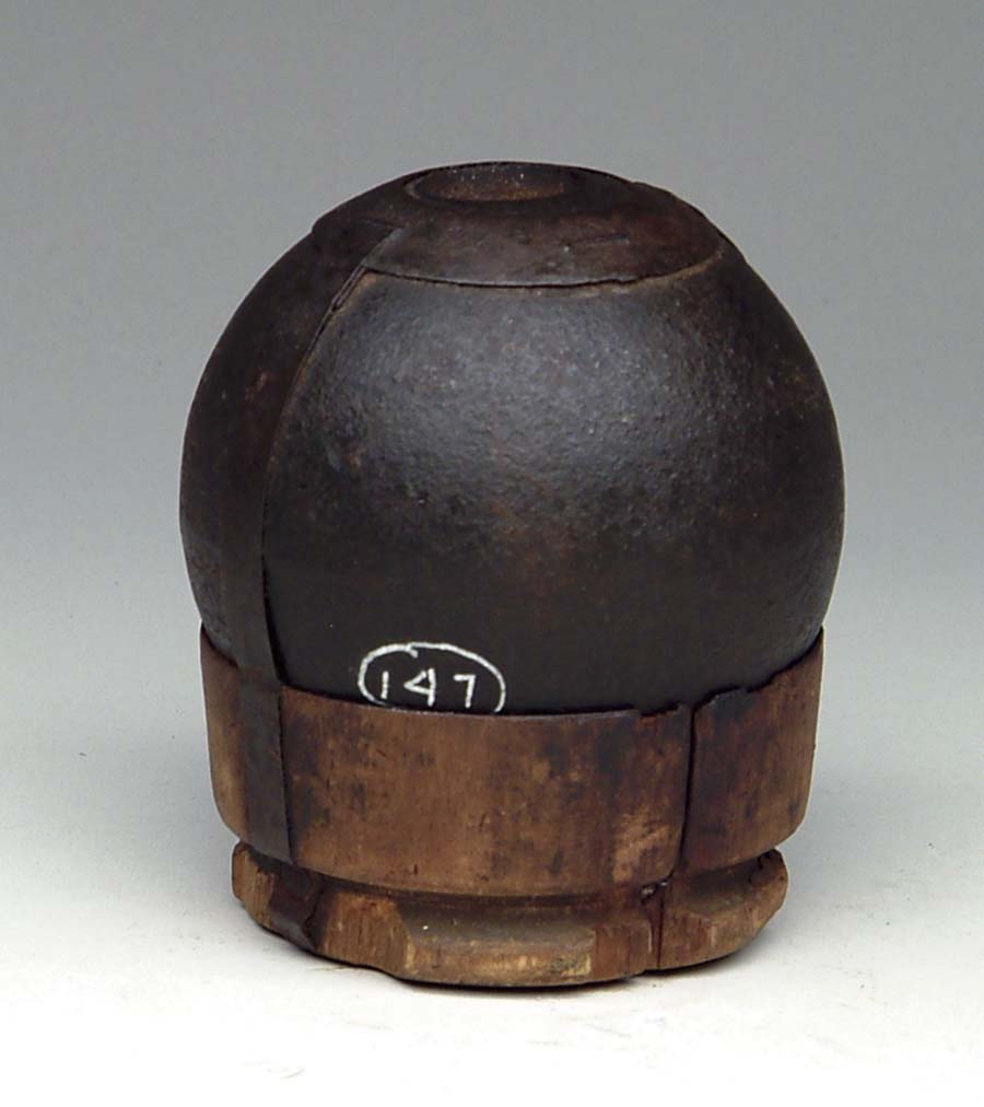 Appraisal: CS -POUNDER WOOD FUSED CANNONBALL ON orig WOODEN SABOT Non-excavated