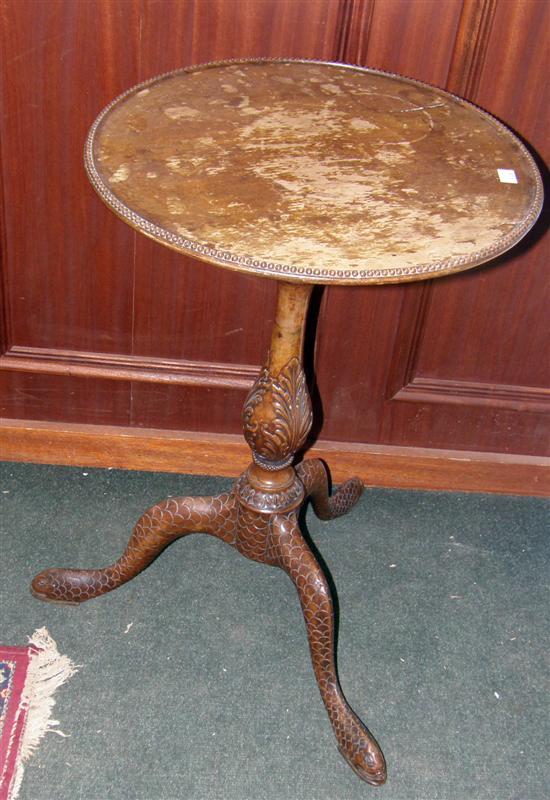 Appraisal: A GEORGIAN MAHOGANY TABLE with carved serpent cabriole legs and