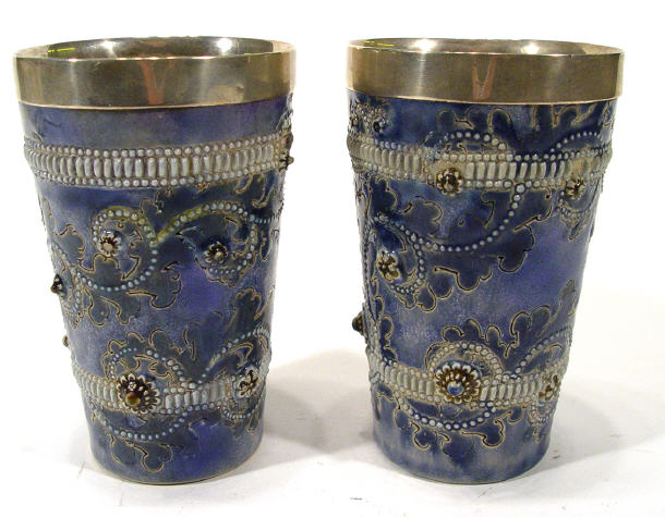 Appraisal: Pair of Doulton Lambeth stoneware beakers with silver rims and