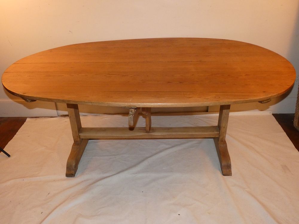 Appraisal: ANTIQUE PINE TRESTLE TABLE Antique pine oval trestle dining table