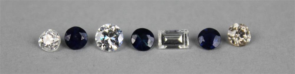 Appraisal: THREE UNMOUNTED BLUE SAPPHIRES AND FOUR UNMOUNTED DIAMONDS the three