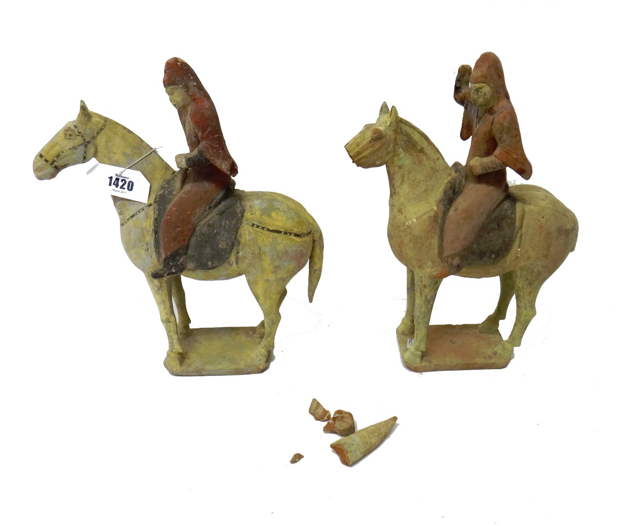 Appraisal: A pair of Chinese pottery equestrian figures Tang dynasty each