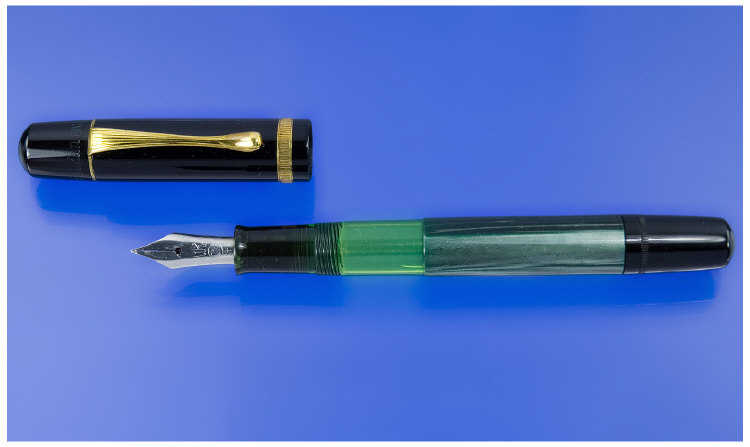 Appraisal: Pelican Visible Fountain Pen Black cap and dark green marbled