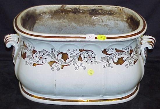 Appraisal: th C English porcelain planter with lustre scrolled foliate decoration