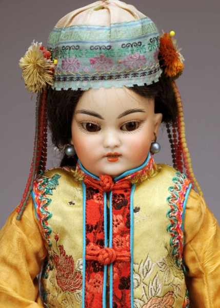 Appraisal: Lovely Simon Halbig Oriental Doll Description Germany Ca Yellow tinted