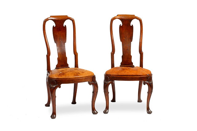 Appraisal: A PAIR OF GEORGE II WALNUT SIDE CHAIRS the backs