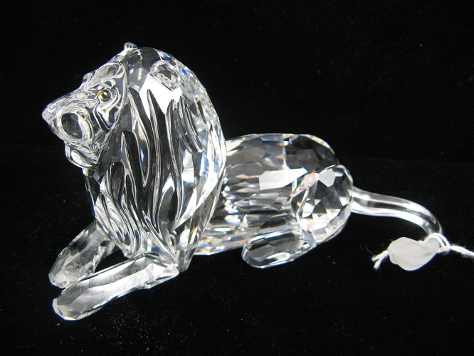 Appraisal: SWAROVSKI AUSTRIAN CUT CRYSTAL LION faceted body with frosted accent