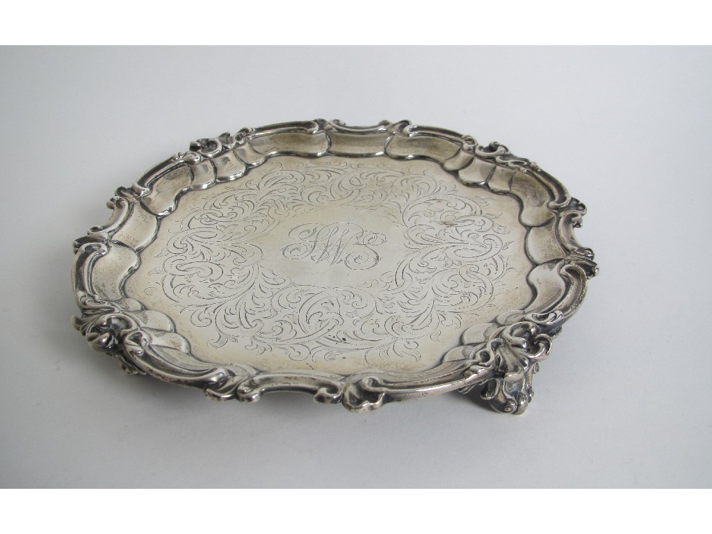 Appraisal: A Victorian silver card tray chased with scrolling foliage and