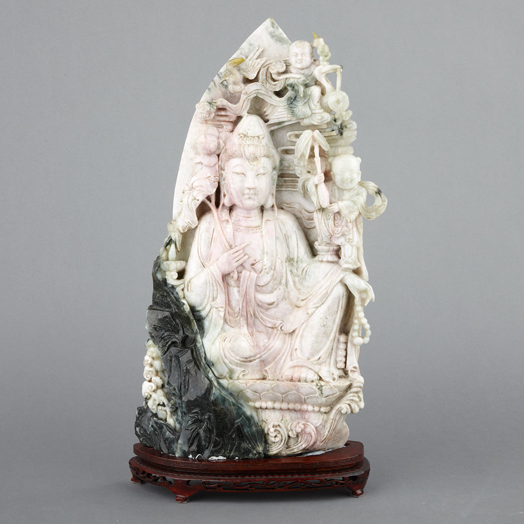 Appraisal: Chinese Jade Guanyin Seated in a position of ease holding