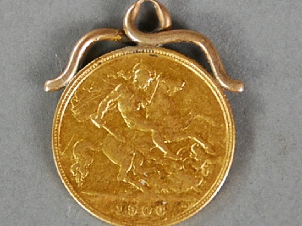 Appraisal: EDWARD VII GOLD HALF SOVEREIGN with soldered scrolled wirework mount