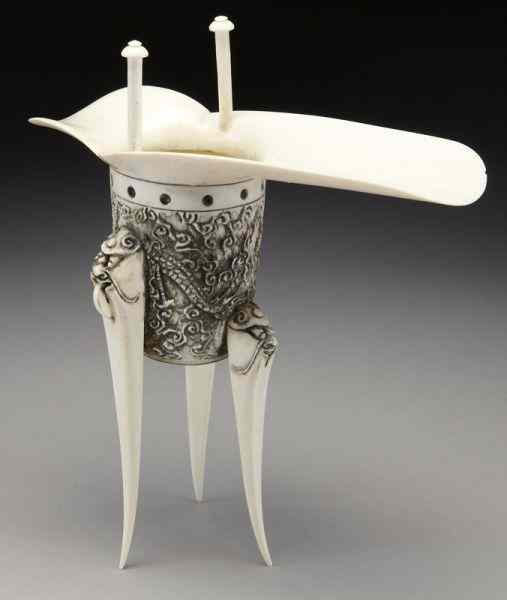 Appraisal: Chinese carved ivory Jue cup depicting dragons International buyers should