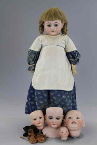 Appraisal: a SIMON HALBIG DOLL FOUR GERMAN HEADS The doll is