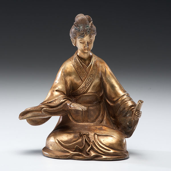 Appraisal: Chinese th century A gilt bronze seated Guanyin holding a